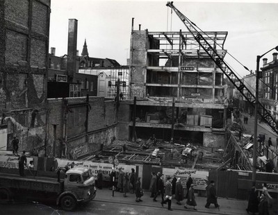 Rebuilding foundations of William Henderson & Sons after fire, 1962.