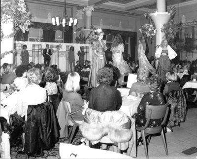  Models on the catwalk in evening gowns at the Helena Geffers fashion show held at Dickins and Jones in September 1951.