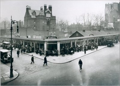 Winter scene of shop front at John Barker's and Co., Kensington, 1921